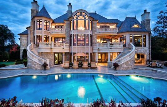 Grand custom residence with curved staircases and pool, a Highmark Builders project